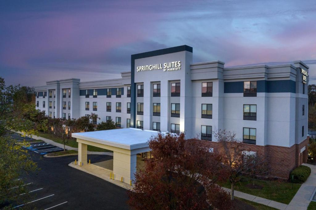 a large white building with a sign on it at SpringHill Suites by Marriott Annapolis in Annapolis