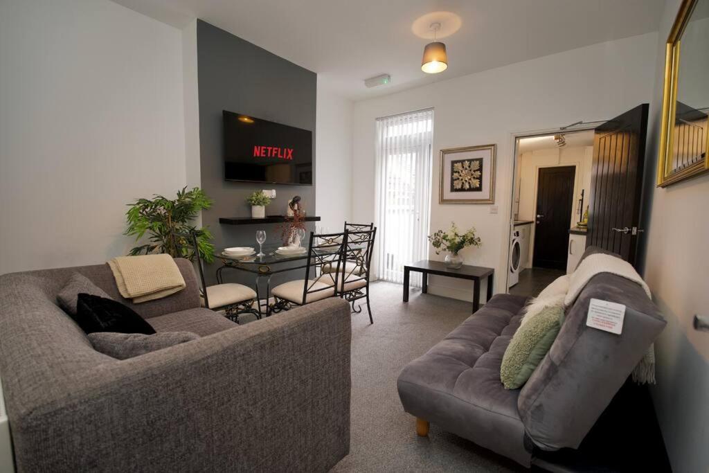 a living room with two couches and a dining room at Gordon House - 4Bed Coventry City Centre Oasis with Free Parking in Coventry
