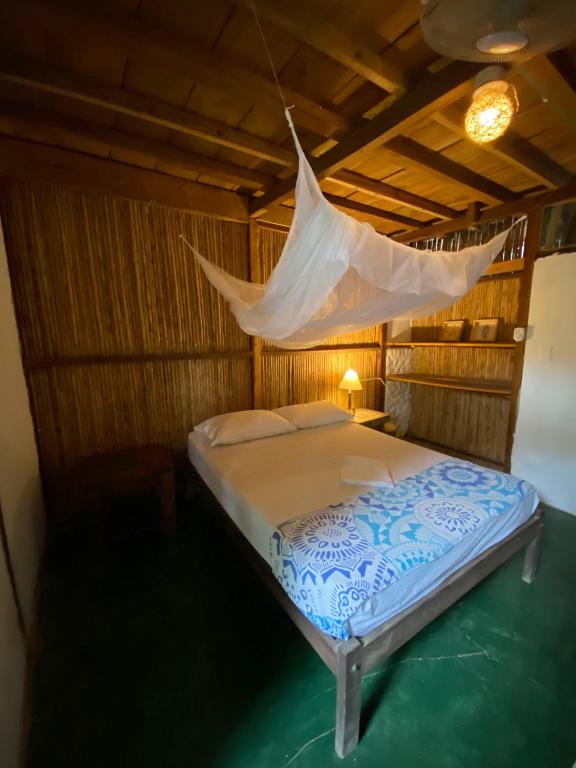 Postel nebo postele na pokoji v ubytování Hostal Zinpar