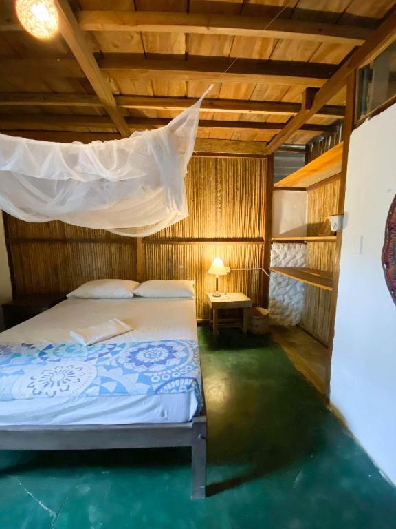 Postel nebo postele na pokoji v ubytování Hostal Zinpar