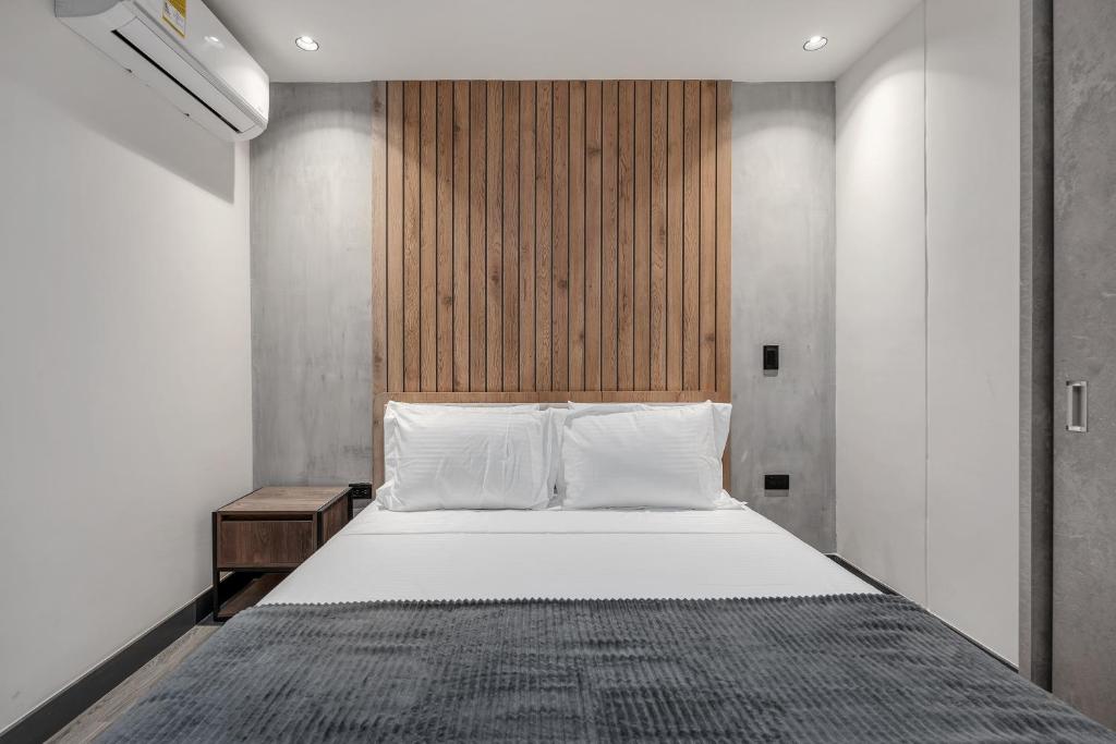 Postel nebo postele na pokoji v ubytování Apartamentos HOUSY Laureles