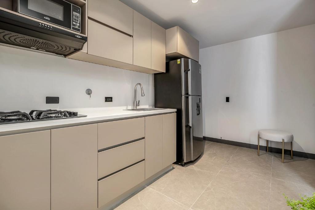 Kuchyň nebo kuchyňský kout v ubytování Apartamentos HOUSY Laureles
