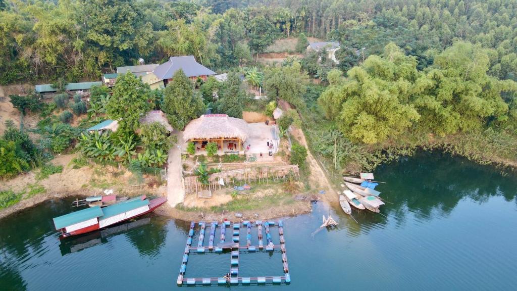 an aerial view of a house on an island in the water at Lakeview Homestay Vu Linh in Yên Bình