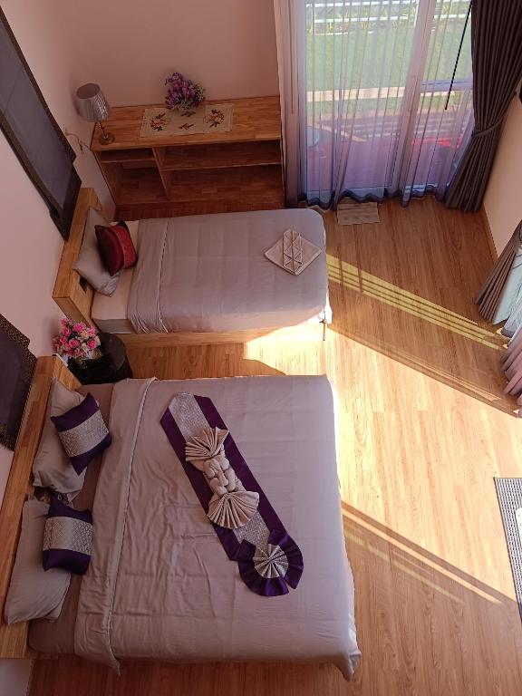 Postel nebo postele na pokoji v ubytování อัญมัน ลันตา Anyaman Lanta