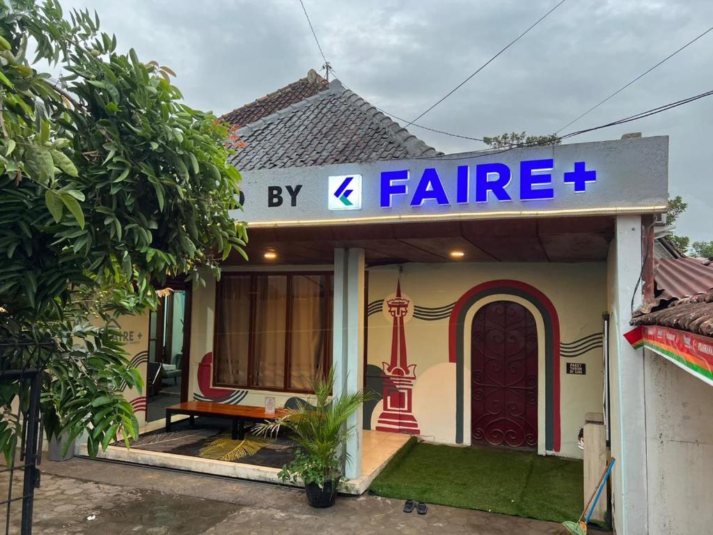 a small house with a sign that reads feline at Faire BNB Homestay in Timuran