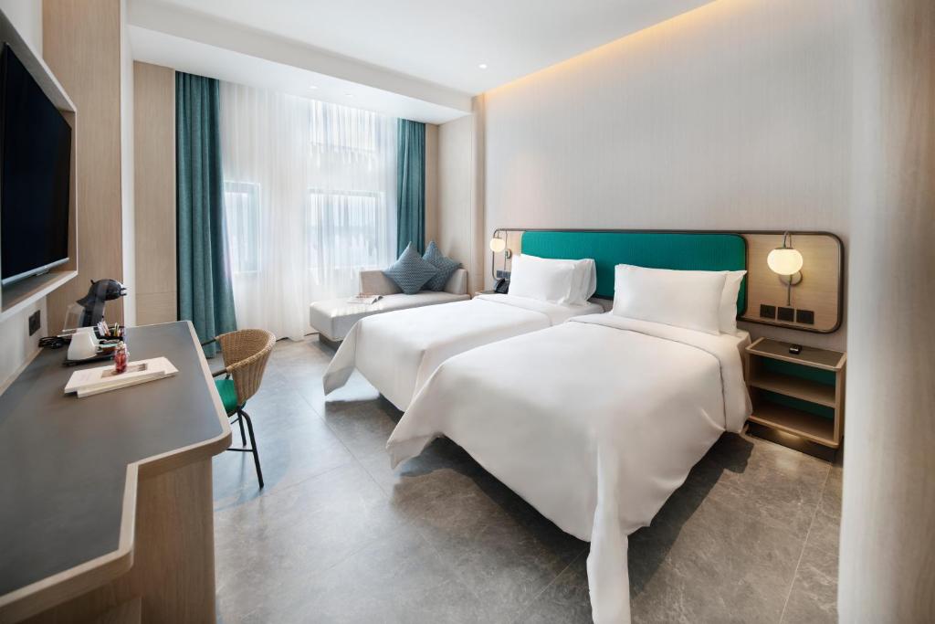 Voodi või voodid majutusasutuse VIVERE Hotel, ARTOTEL Curated toas