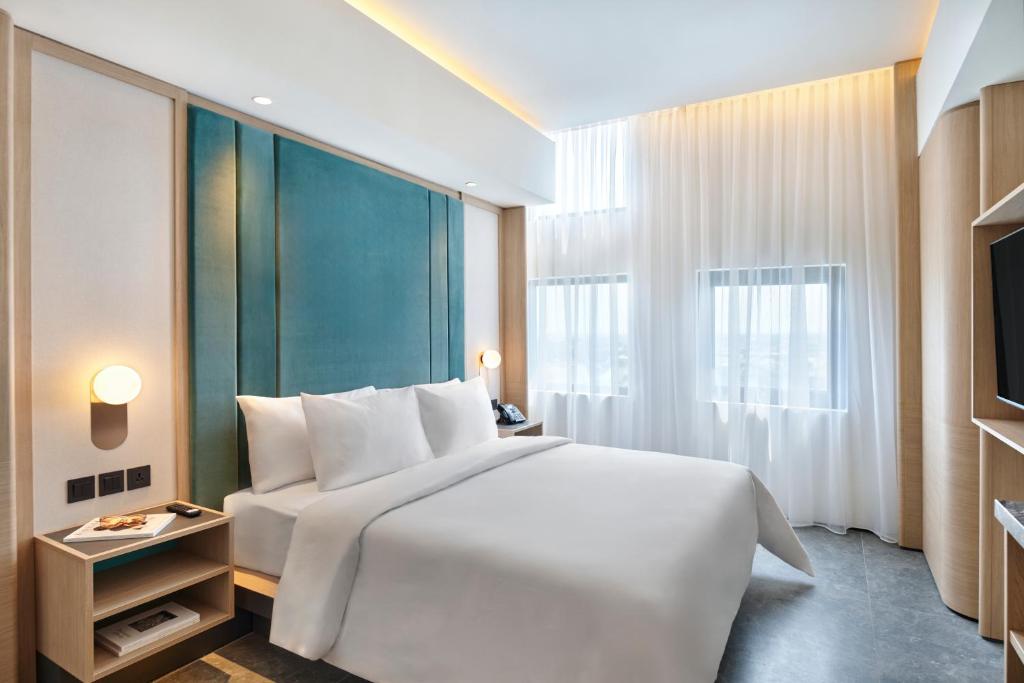 Voodi või voodid majutusasutuse VIVERE Hotel, ARTOTEL Curated toas