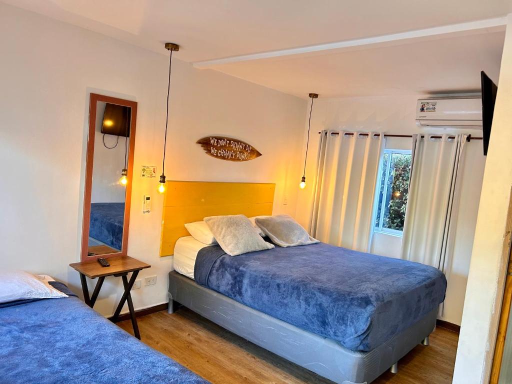 Postel nebo postele na pokoji v ubytování Be Happy Hotel