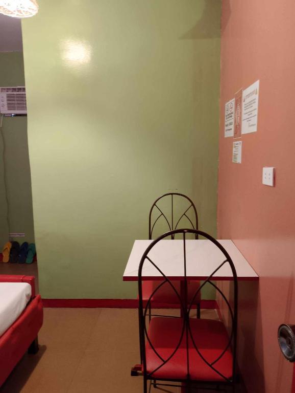 Postel nebo postele na pokoji v ubytování WJV INN PALAWAN