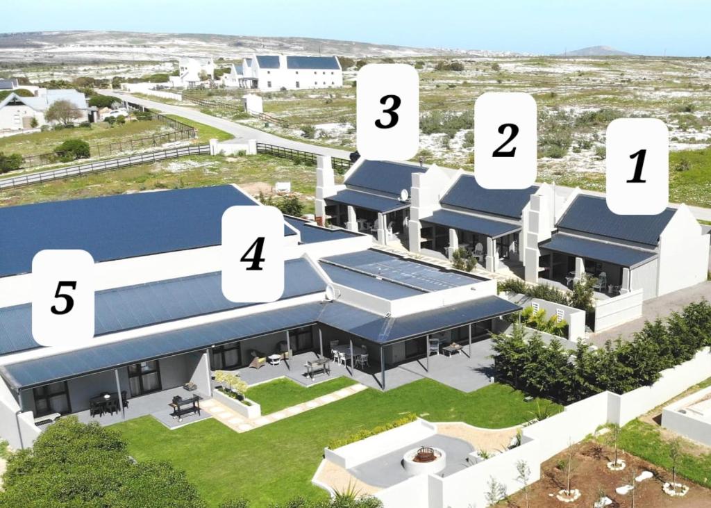 a rendering of the exterior of a building at Three Feathers Cottages in Langebaan