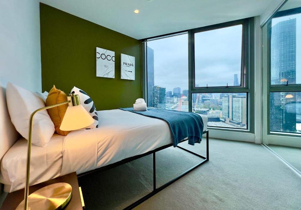a bedroom with a bed and a large window at 1 BRM, Sea View, Newly Renovated, Next to Crown in Melbourne