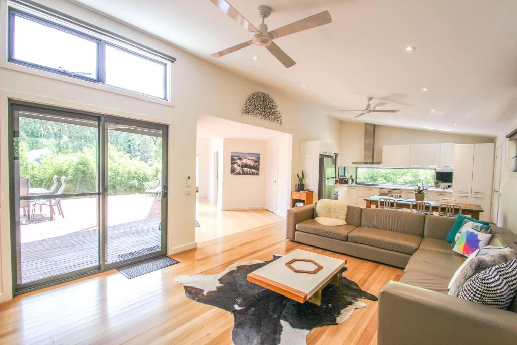 a living room with a couch and a table at The Base One in Harrietville