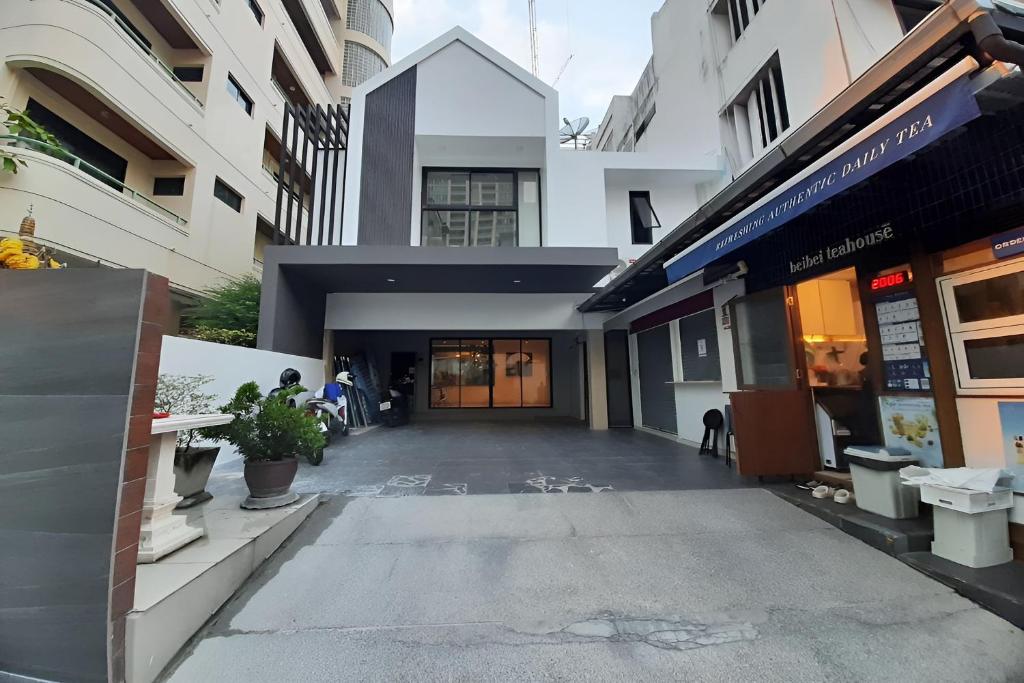 an empty street in front of a building at Cordia Residence Saladaeng in Bangkok