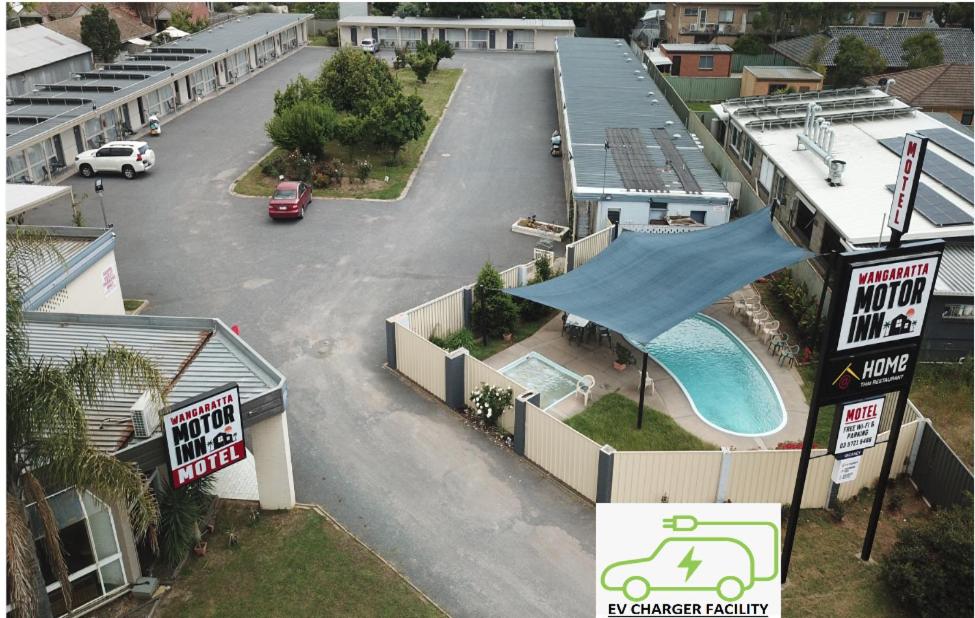 an aerial view of a parking lot with a swimming pool at Wangaratta Motor Inn in Wangaratta