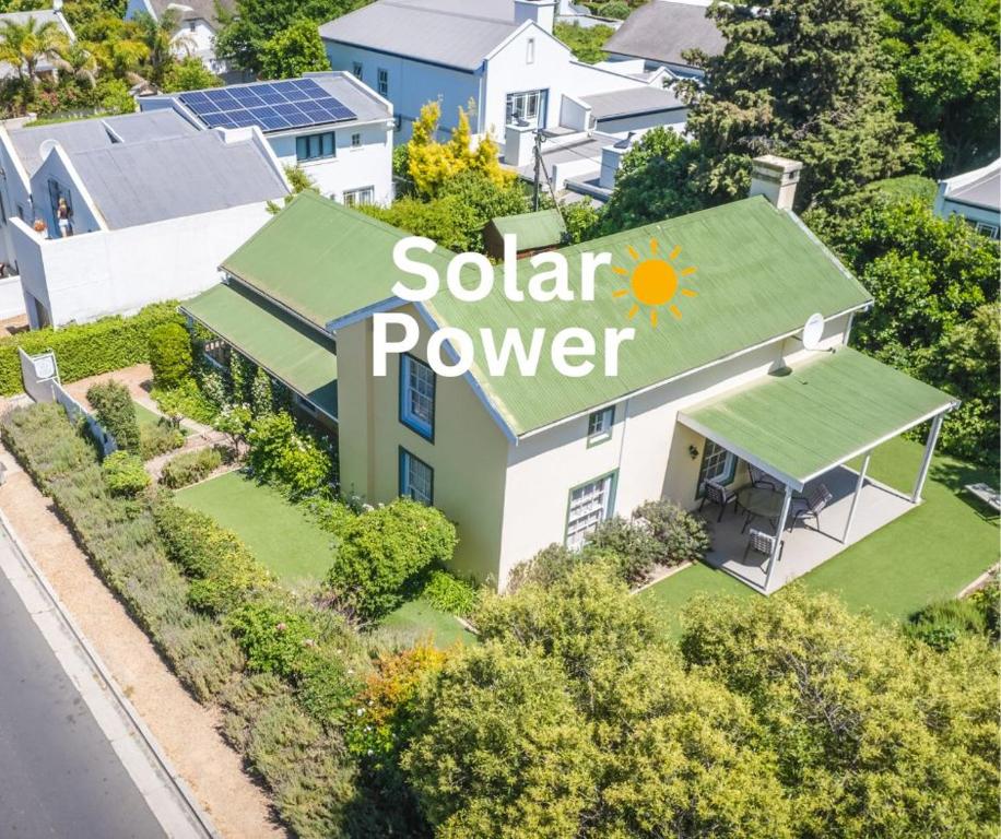 an aerial view of a house with a solar power sign on it at Lavender Cottage in Franschhoek