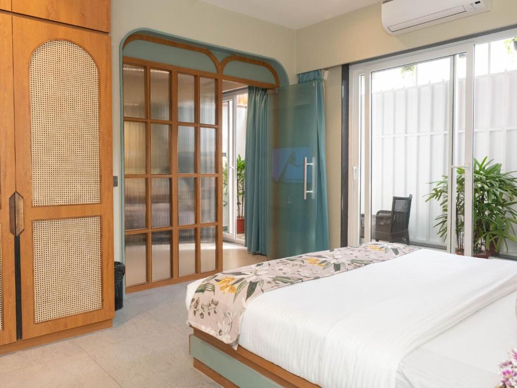 Postel nebo postele na pokoji v ubytování Calangute Towers - AM Hotel Kollection