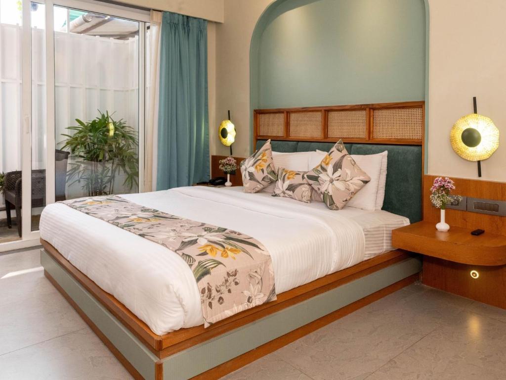 Postel nebo postele na pokoji v ubytování Calangute Towers - AM Hotel Kollection