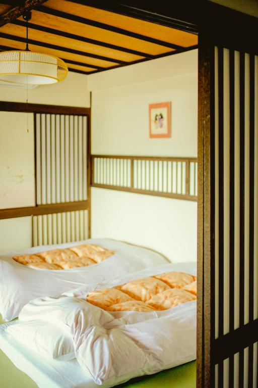 Postel nebo postele na pokoji v ubytování Trip7箱根仙石原温泉ホテル