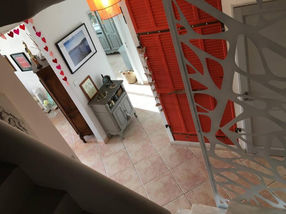an overhead view of a stairway with a red shutter at FLC-Sea View-Jacuzzi-3 Bedrooms-8p-Parking for 2 cars in Marseille