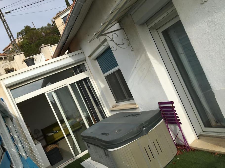 a trash can sitting outside of a house at FLC-Sea View-Jacuzzi-3 Bedrooms-8p-Parking for 2 cars in Marseille