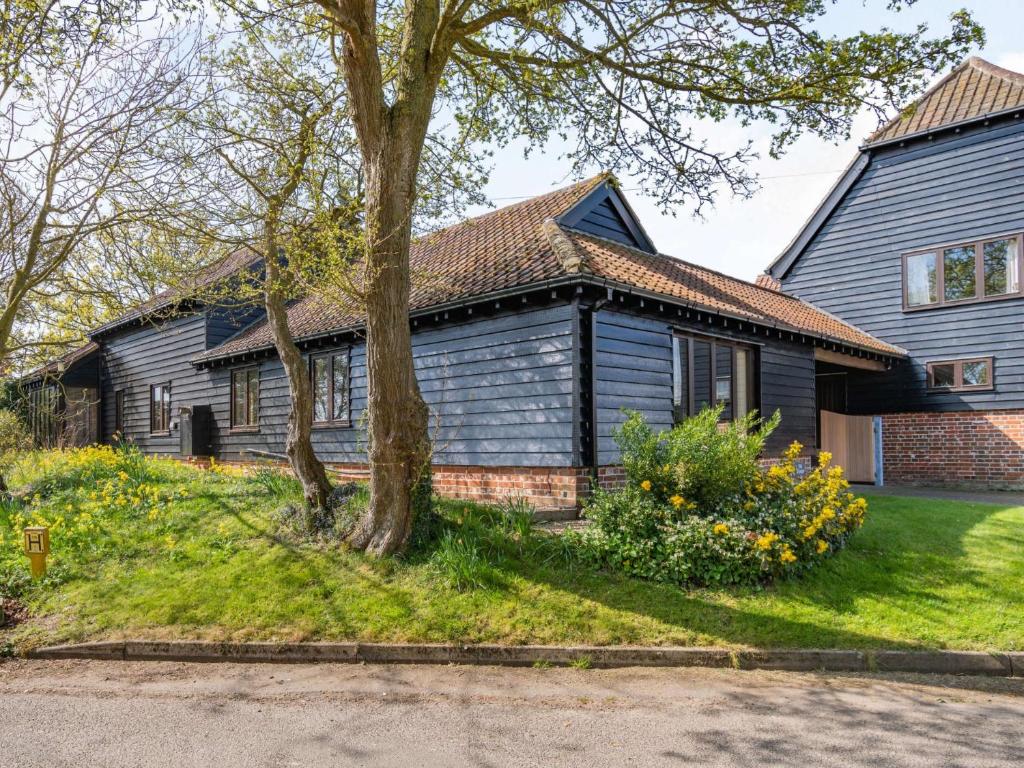 a blue house with a tree in front of it at 2 bed in Hadleigh 87956 