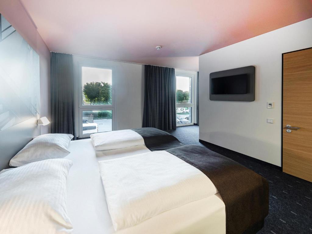Postel nebo postele na pokoji v ubytování B&B Hotel Dessau
