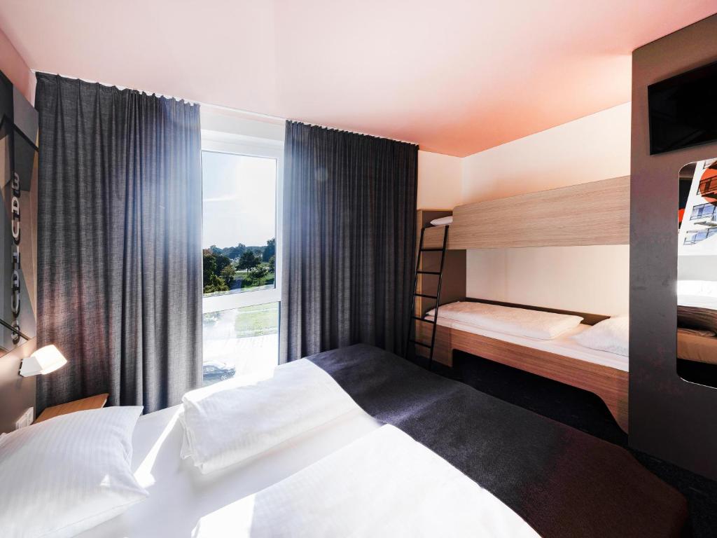 Postel nebo postele na pokoji v ubytování B&B Hotel Dessau