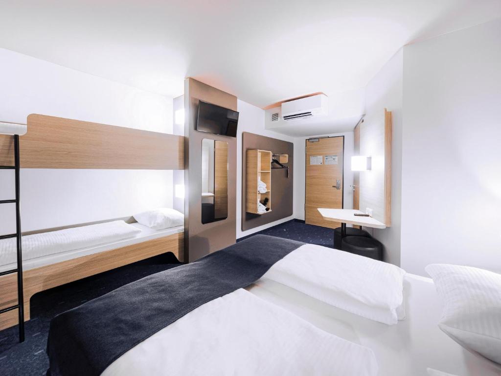 Postel nebo postele na pokoji v ubytování B&B Hotel Dessau
