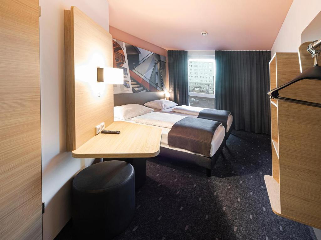 Postel nebo postele na pokoji v ubytování B&B Hotel Dessau