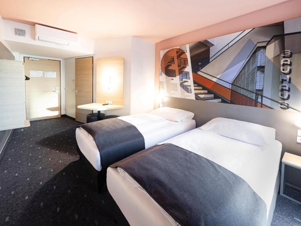 Postel nebo postele na pokoji v ubytování B&B Hotel Dessau