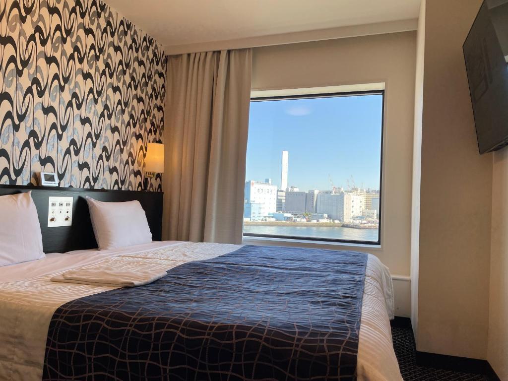 Postel nebo postele na pokoji v ubytování Bayside Hotel Azur Takeshiba