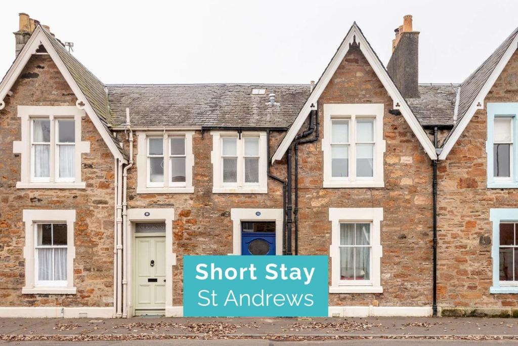 a brick house with a sign that says short stay st ambassadors at Park Place Elie, Perfect for the beach in Elie