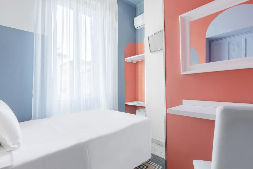 Postel nebo postele na pokoji v ubytování Hotel Infinito - Gruppo BLAM HOTELS