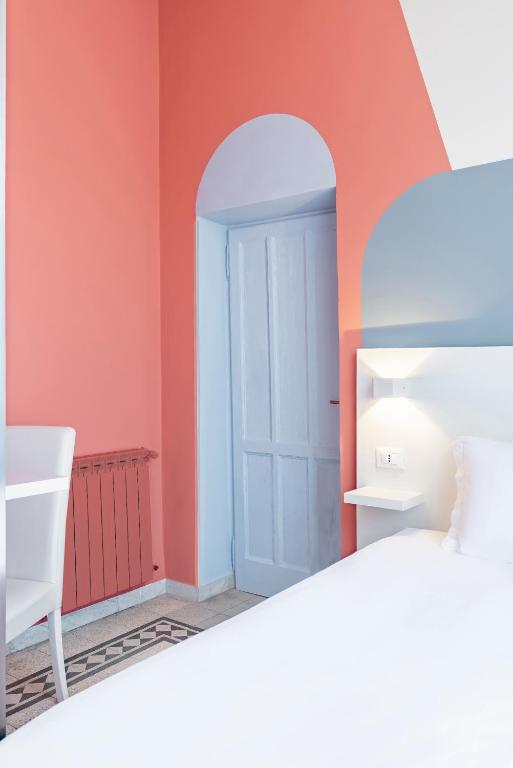 Postel nebo postele na pokoji v ubytování Hotel Infinito - Gruppo BLAM HOTELS