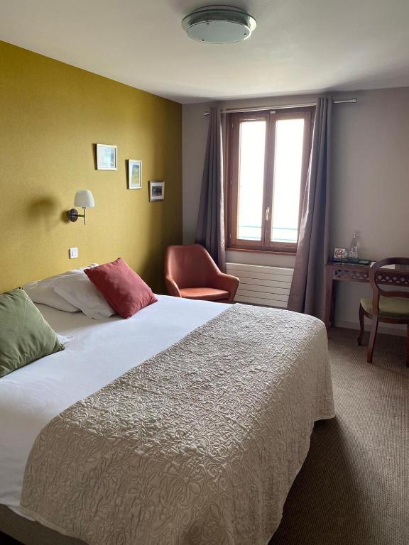 Postel nebo postele na pokoji v ubytování Hôtel de la Plage