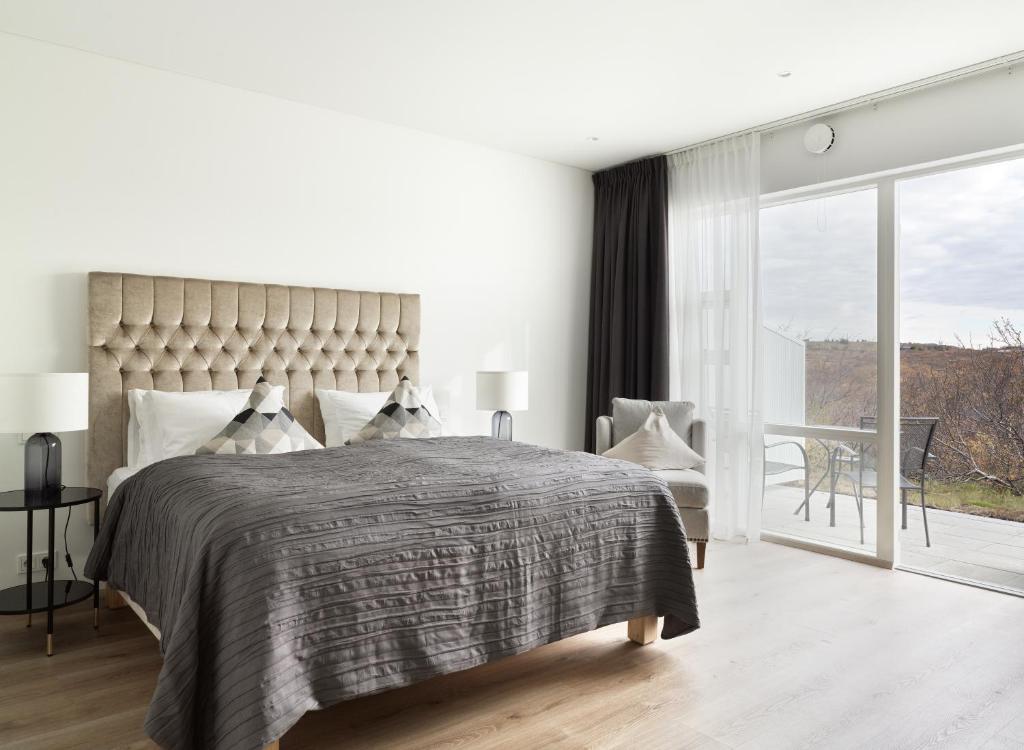 Rúm í herbergi á Hotel Grimsborgir by Keahotels