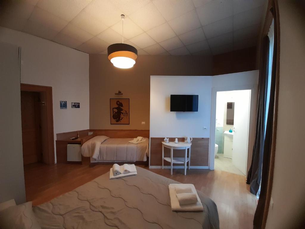 Posteľ alebo postele v izbe v ubytovaní BelloBello Rooms&Apartment