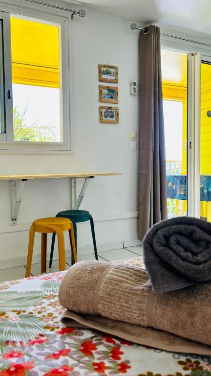 Postel nebo postele na pokoji v ubytování Bungalow Jazz - Bassin Manapany-Les-Bains