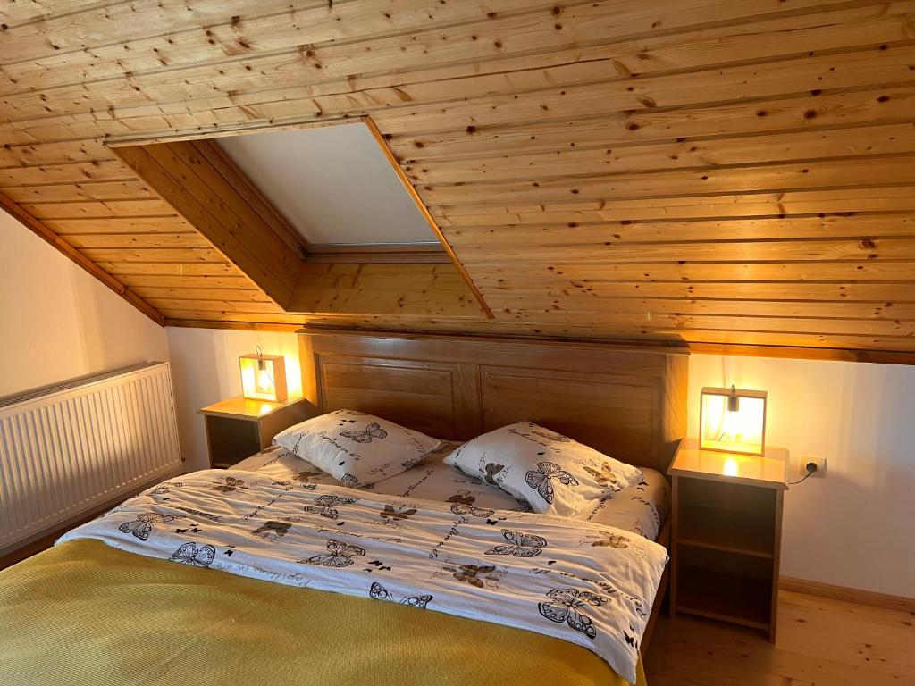 Postel nebo postele na pokoji v ubytování Serenity Colibița