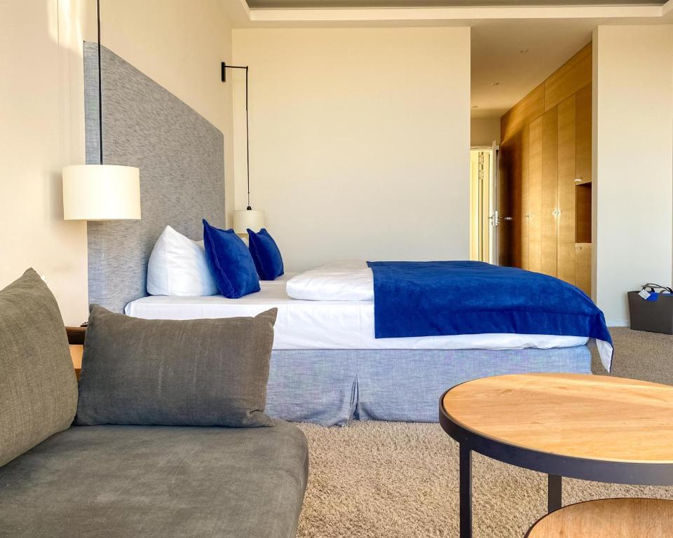 Postel nebo postele na pokoji v ubytování SeeHuus Lifestyle Hotel