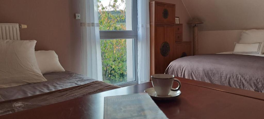 Postel nebo postele na pokoji v ubytování Villa des Climats Bourgogne