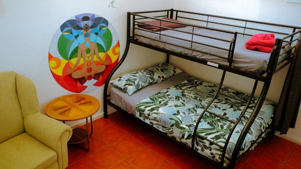 Postel nebo postele na pokoji v ubytování Backpackers at 1770