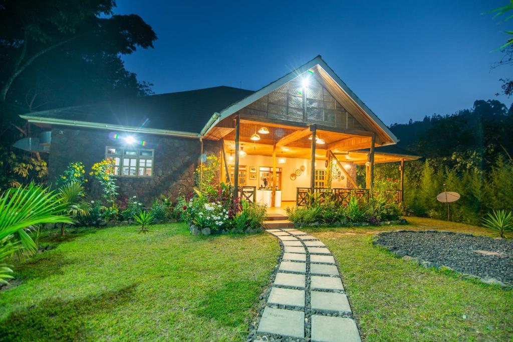 a house with a pathway leading to it at Gorilla Leisure Lodge in Kisoro