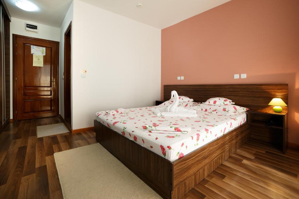 Postel nebo postele na pokoji v ubytování Hotel Insula