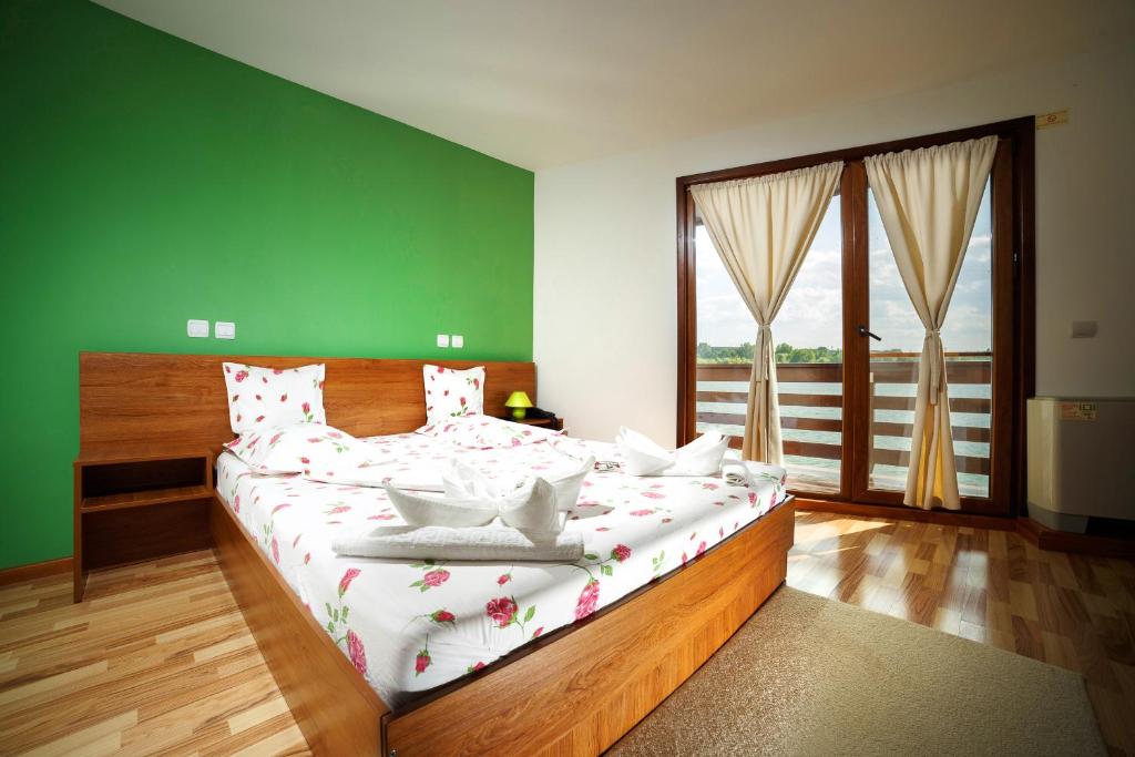 Postel nebo postele na pokoji v ubytování Hotel Insula