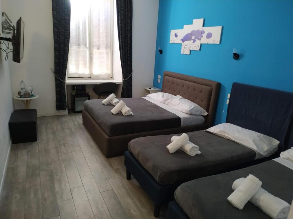 Letto o letti in una camera di Roma Centrale Fidelis