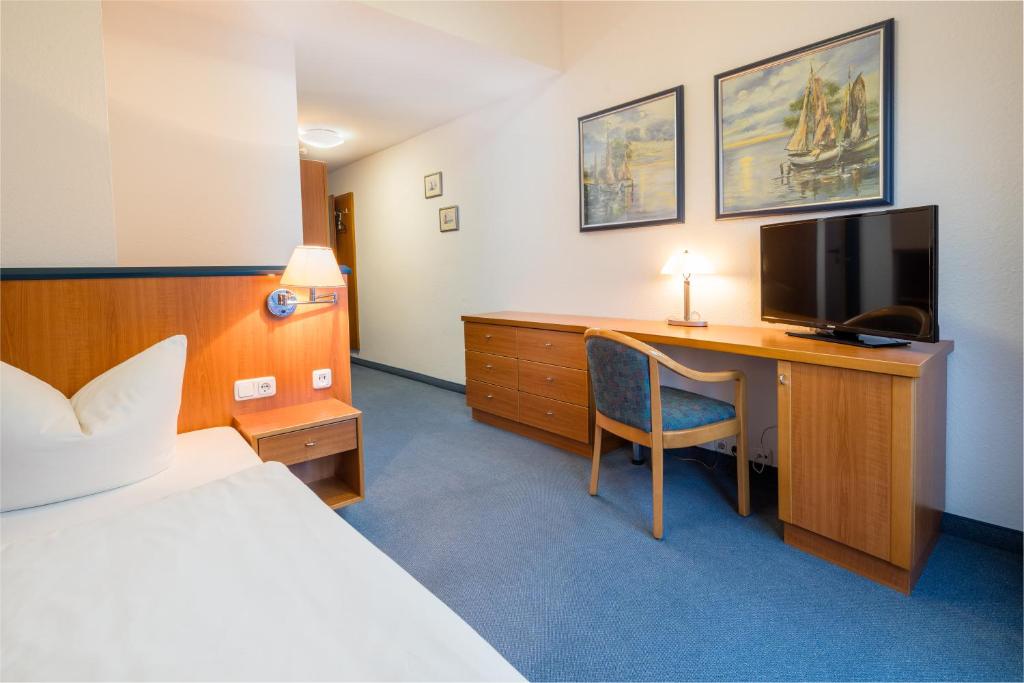 Postel nebo postele na pokoji v ubytování Gästehaus Gelsenkirchen