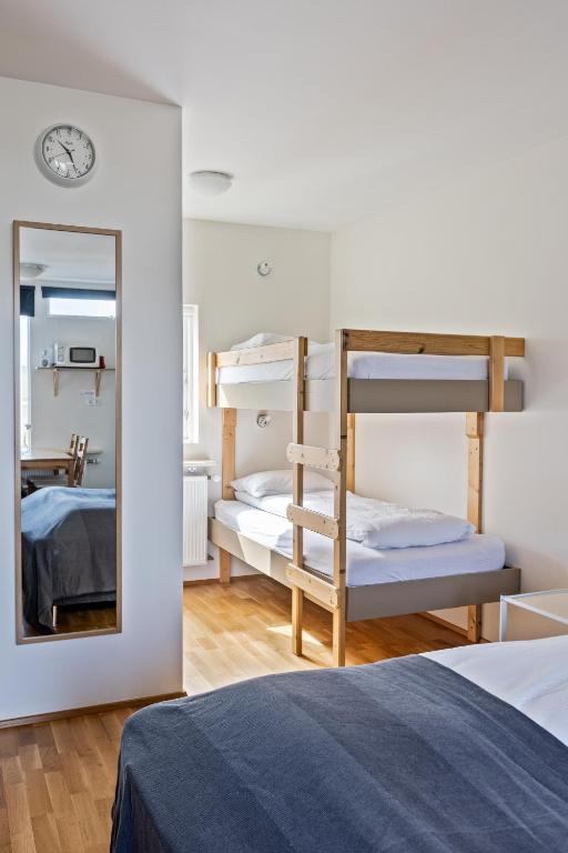 Postel nebo postele na pokoji v ubytování South Central Apartments