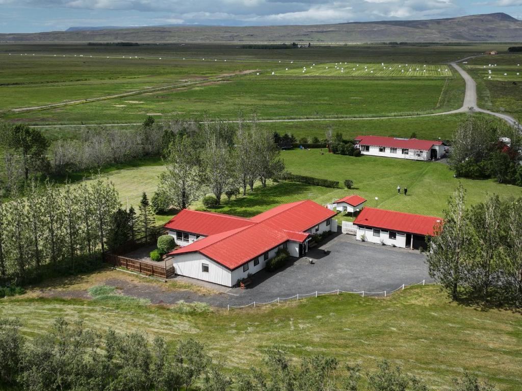 an aerial view of a farm with red roofs at South Central Guesthouse in Selfoss