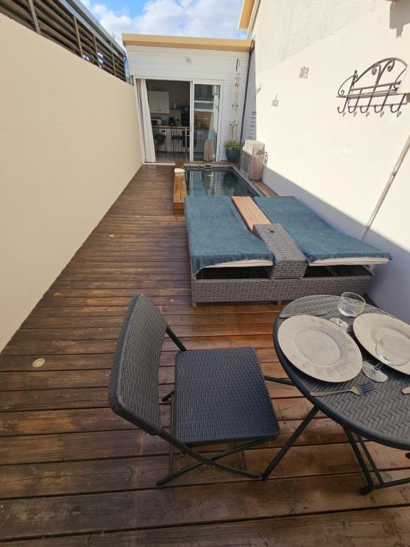 Balkón nebo terasa v ubytování Tiny Badamier Blanc appartement 4 étoiles 2 à 4 personnes piscinelle chauffée